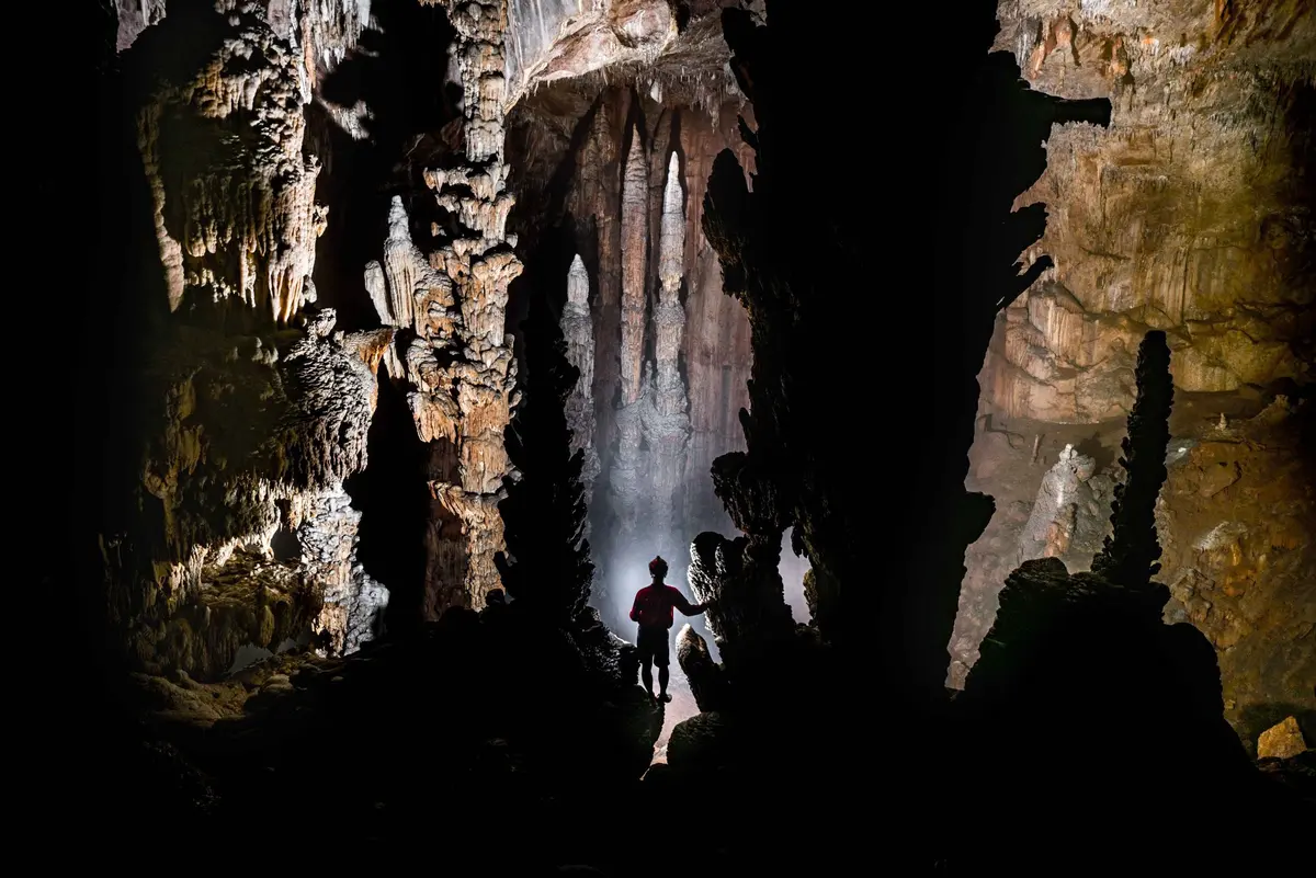 Caving deep inside a cave near Cave Lodge
