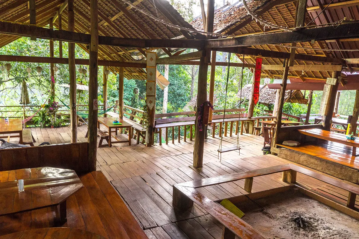 The teak main house at Cave Lodge