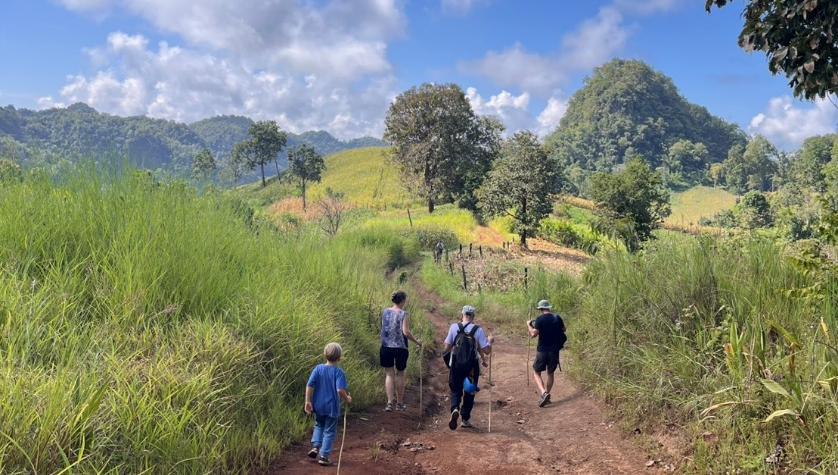 Hikers on the karst trail between caves